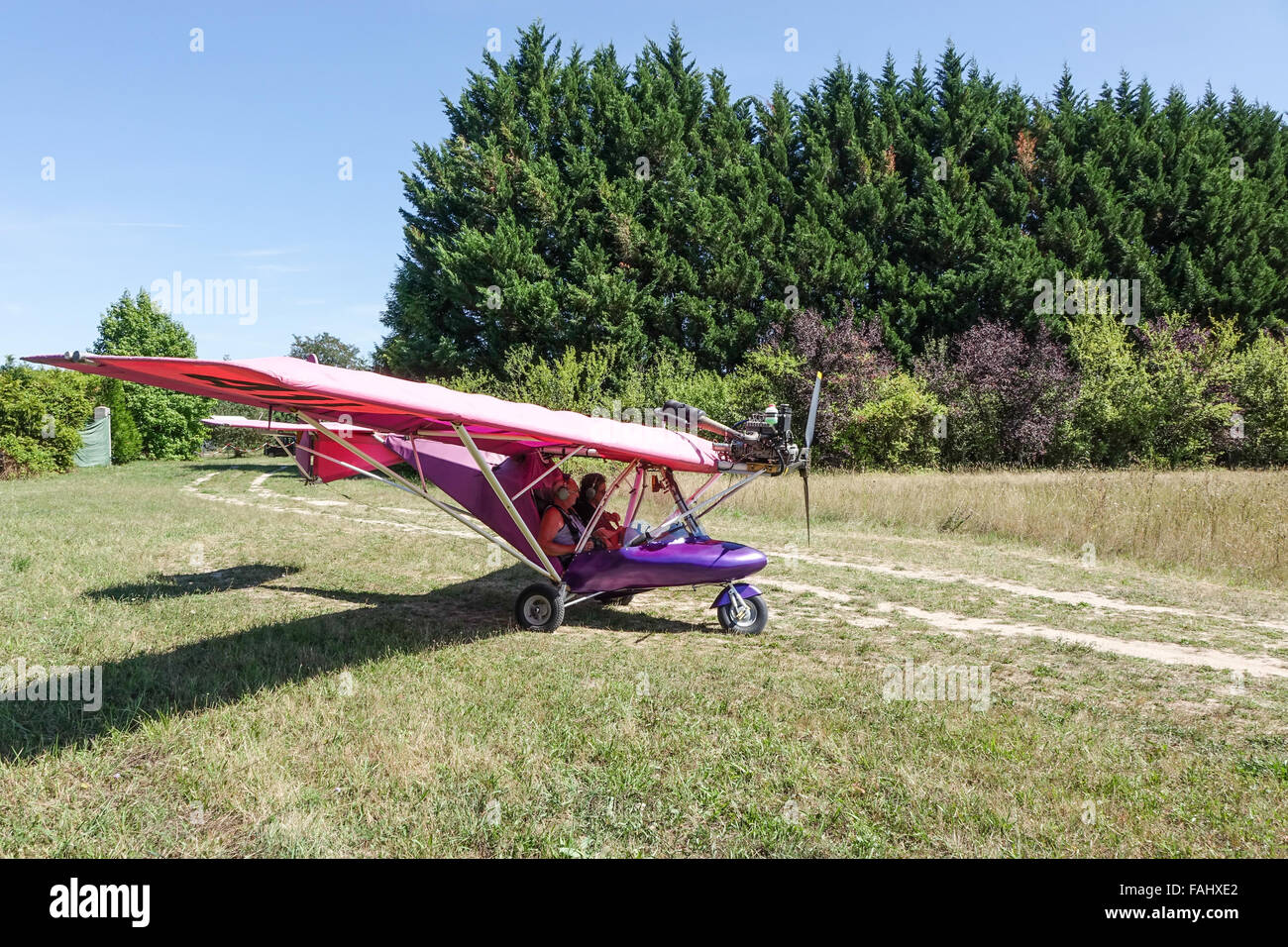 ULM Microlite, purple Microlight plane taxiing for take off near Francueil, Loire Valley, France Stock Photo
