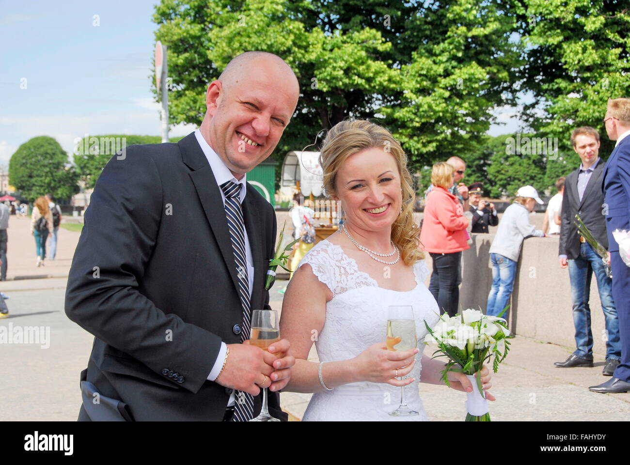 Newly wedded couple on the bank of the Neva River in St. Petersburg, Russia Stock Photo