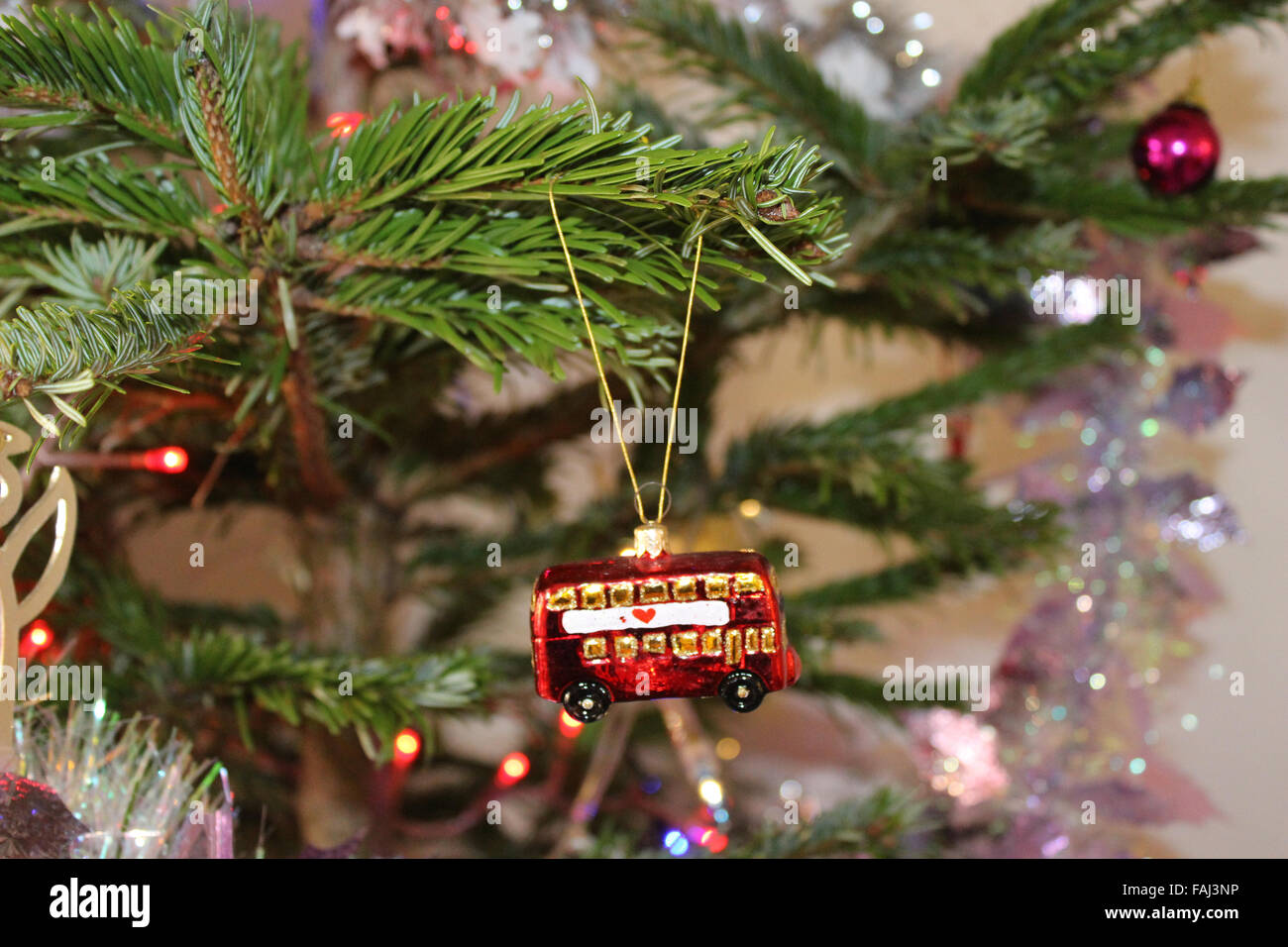 A London Bus Christmas Decoration Hangs From A Christmas Tree Stock Photo Alamy