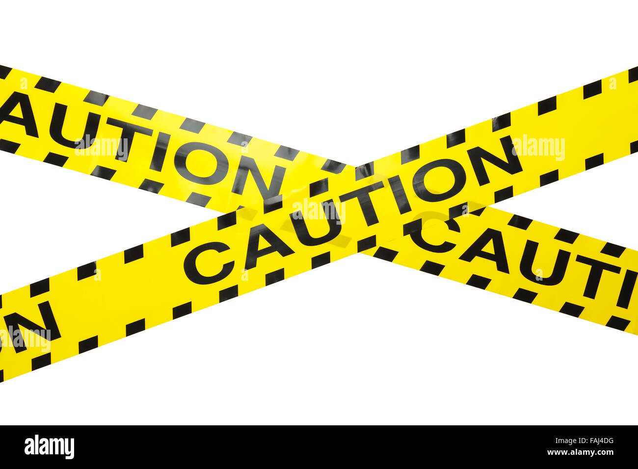 Yellow Caution Crime Scene Tape Criss Crossed Isolated on a White Background. Stock Photo