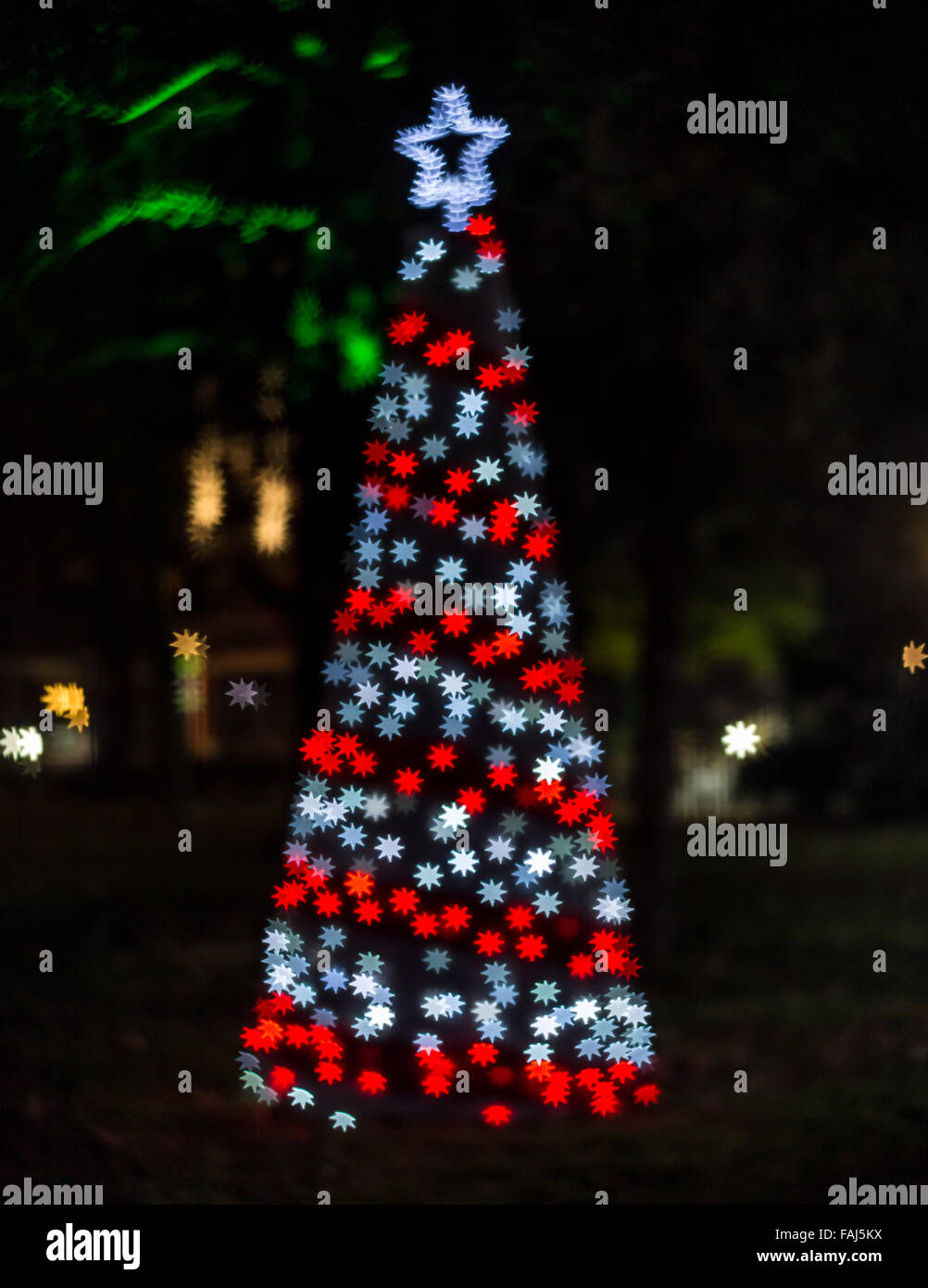 Christmas tree with star shaped bokeh lights Stock Photo
