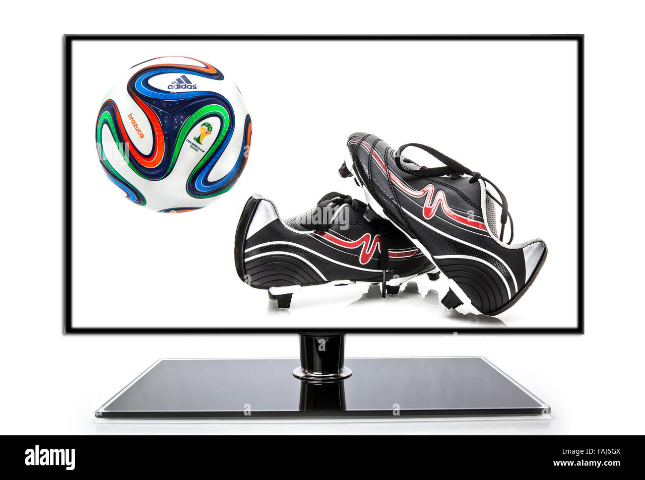 Adidas Brazuca World Cup 2014 Football, The Official Match ball for the 2014 World Cup with football Boots and TV Stock Photo