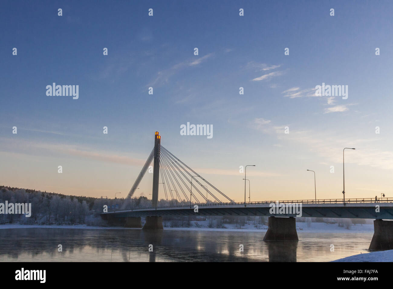 Beautiful vibrant scandinavian winter scene: Bridge over Kemijoki river Stock Photo