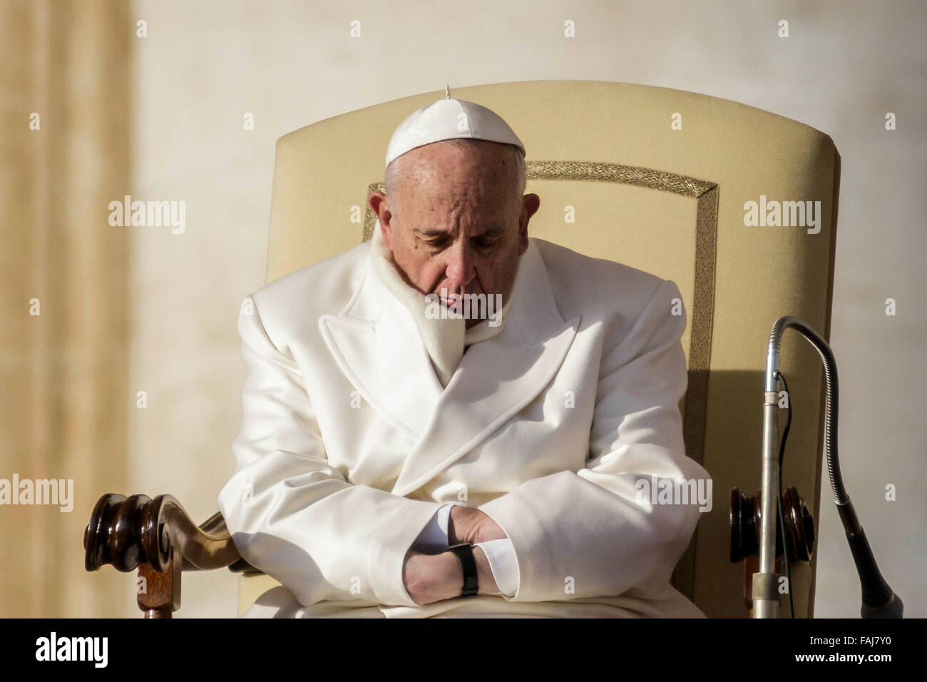 Vatican City, Vatican. 30th Dec, 2015. Pope Francis uses his sleeves as ...