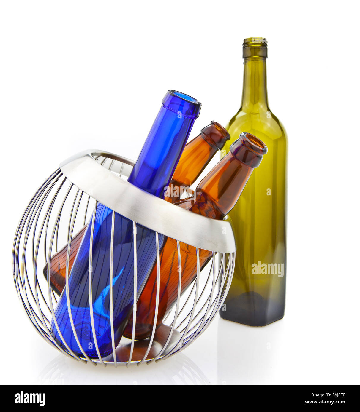 Empty glass bottles in wire basket isolated over the white background Stock Photo