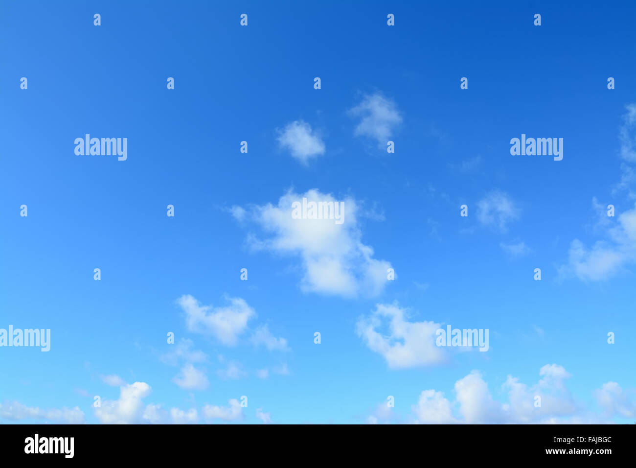 sunny blue sky and soft white clouds Stock Photo - Alamy
