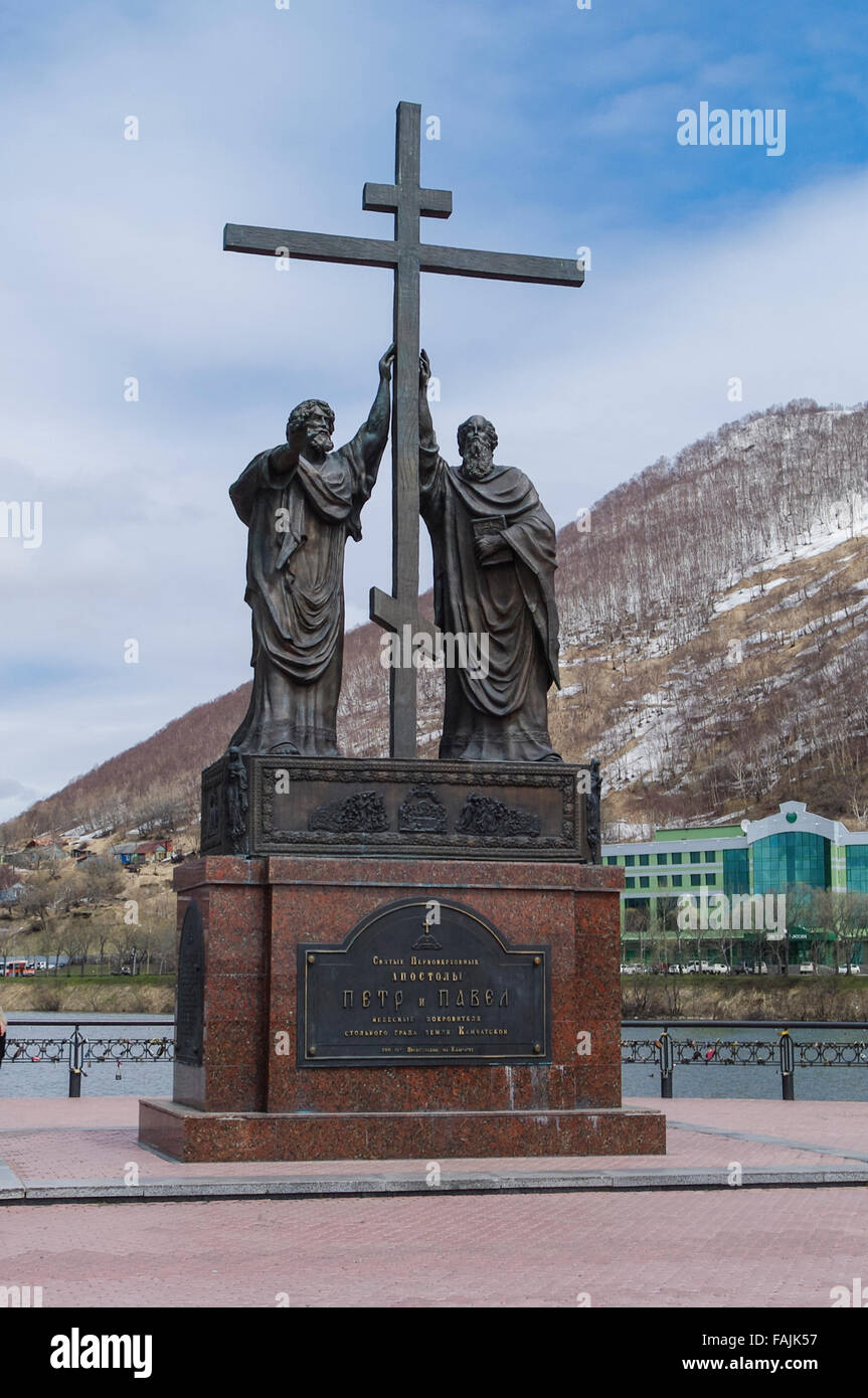 Statue of apostles Peter and Paul (Petr i Pavel), the patron saints of Petropavlovsk-Kamchatskiy, Russia, with an orthodox cross Stock Photo
