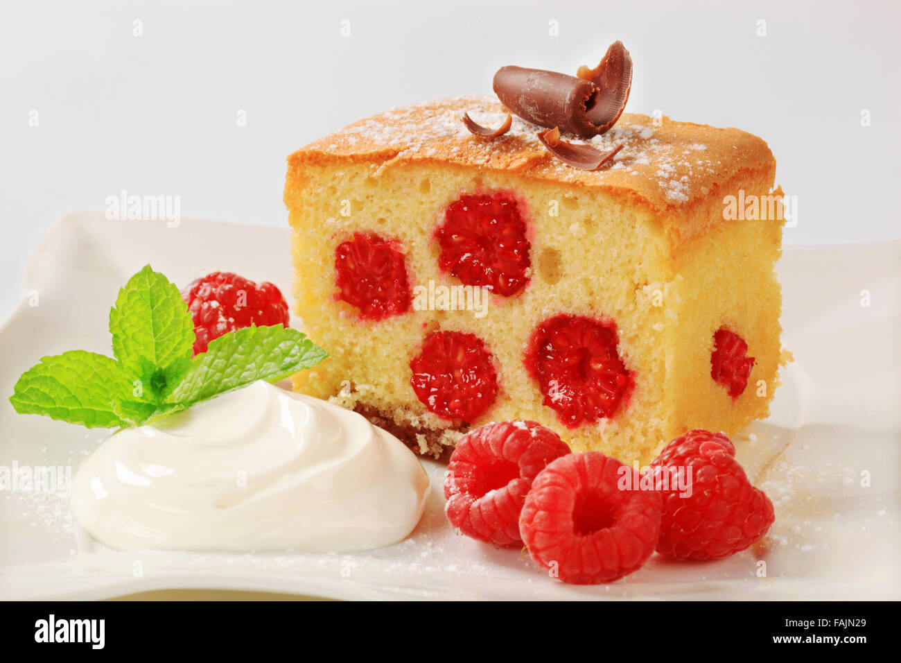 Raspberry sponge cake with whipped cream Stock Photo Alamy