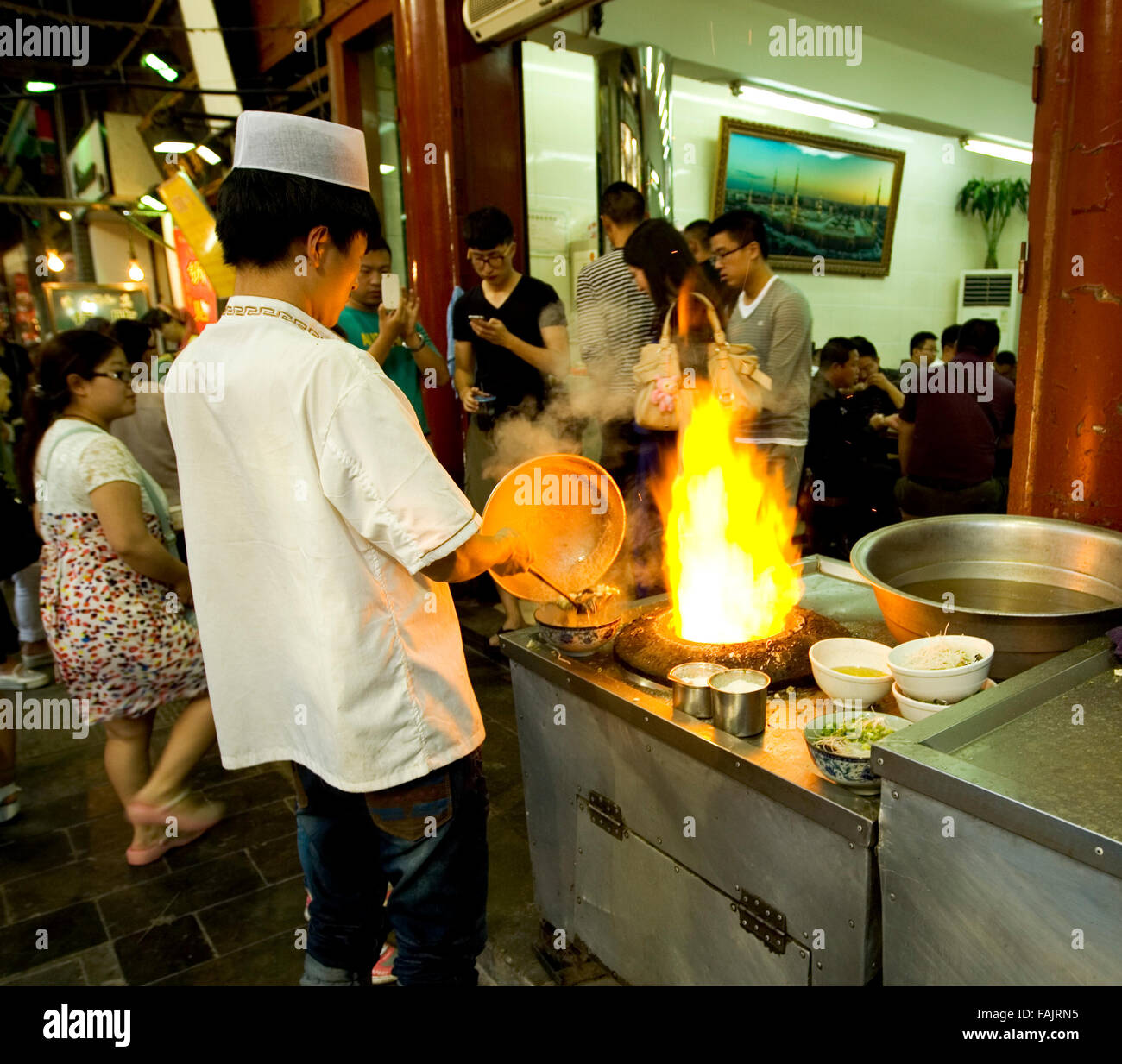 Chef cooking street food in China Vietnam Stock Photo