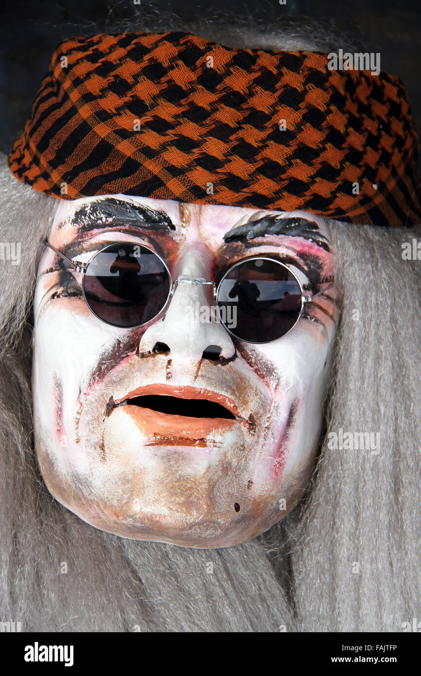 A single basel carnival mask showing and old man with cool sunglasses Stock Photo