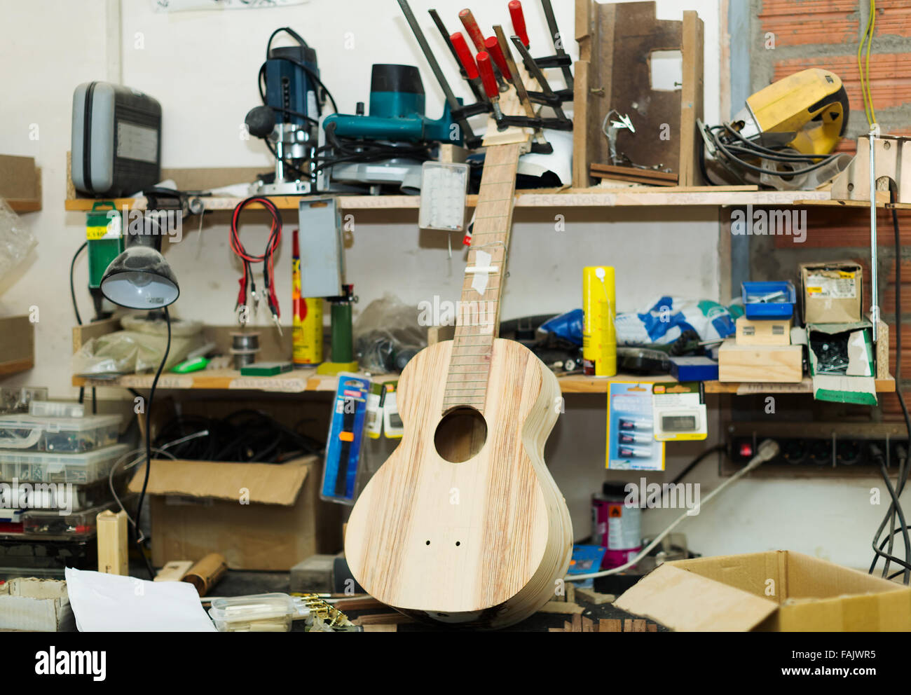 Unfinished acoustic guitar and equipment Stock Photo Alamy
