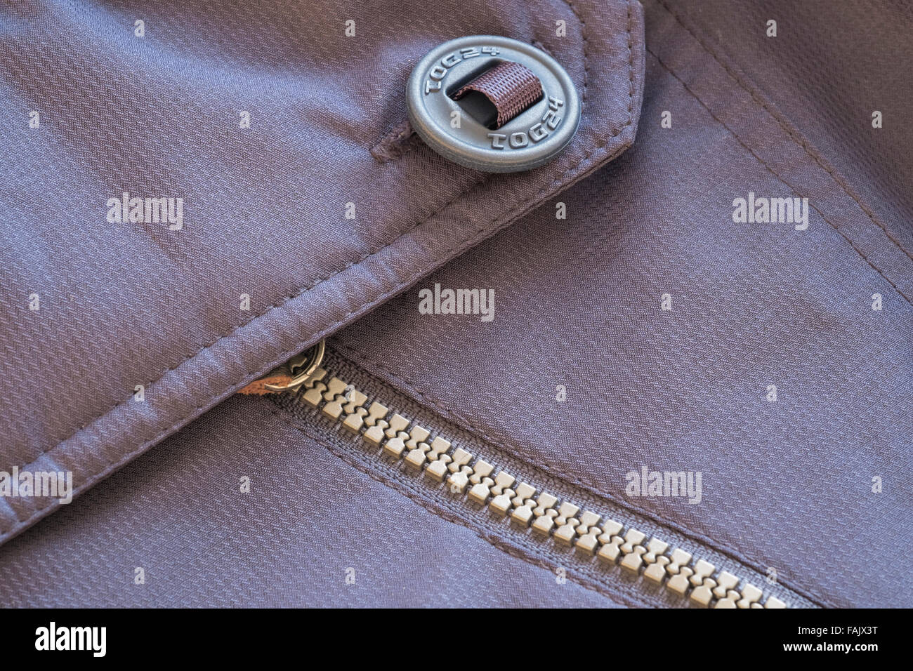 Close up of zipper and button on waterproof jacket Stock Photo Alamy