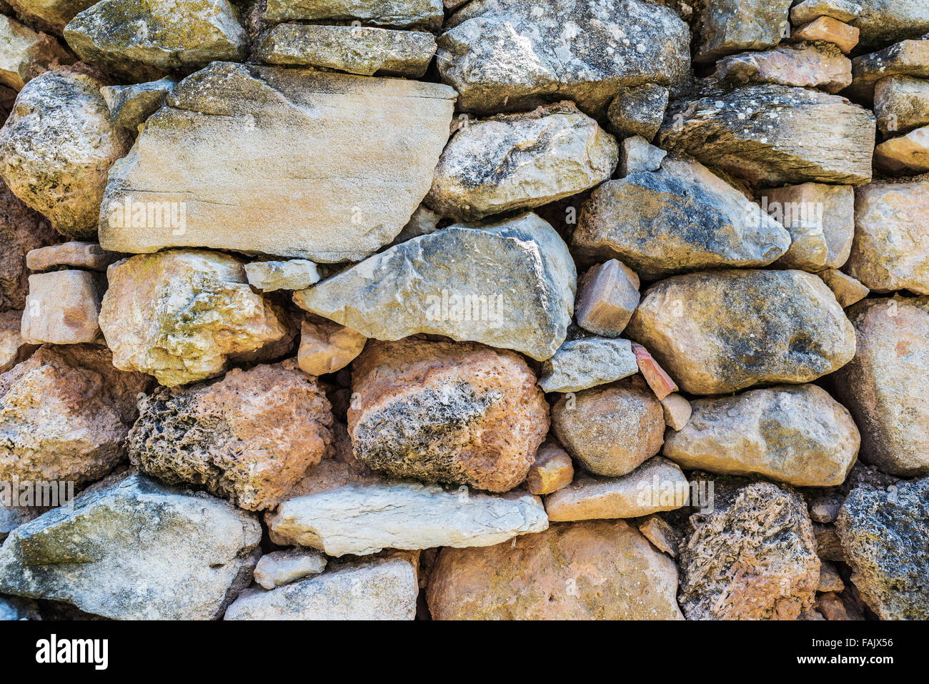 Stone wall of an old house as a background Stock Photo - Alamy