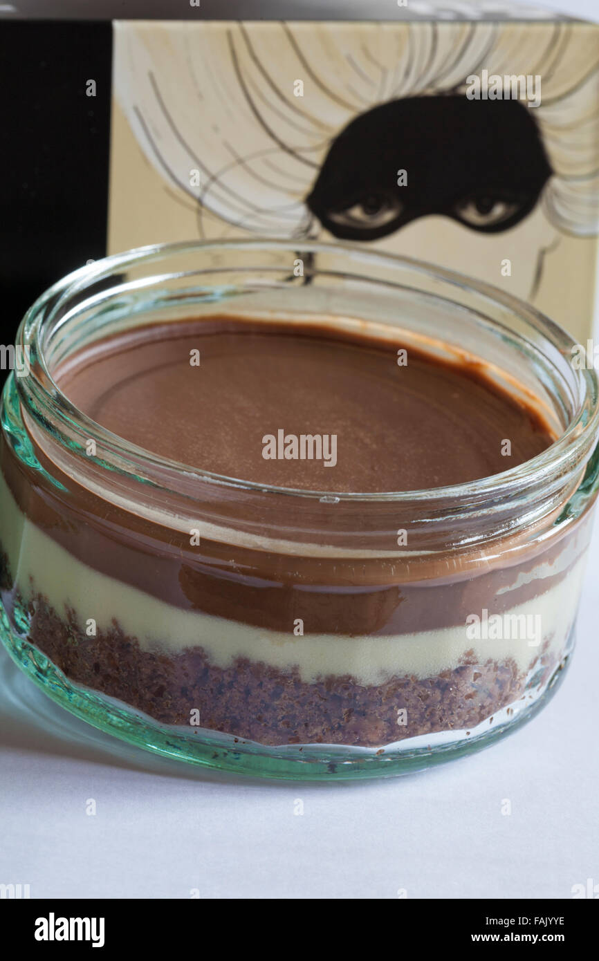 Gu After Dark Chocolate & Vanilla Cheesecakes with one ramekin removed and  lid off Stock Photo - Alamy