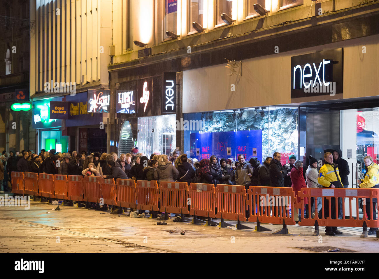 Shoppers queue from 2am for the Next Boxing Day Christmas sales in Cardiff, South Wales. Stock Photo
