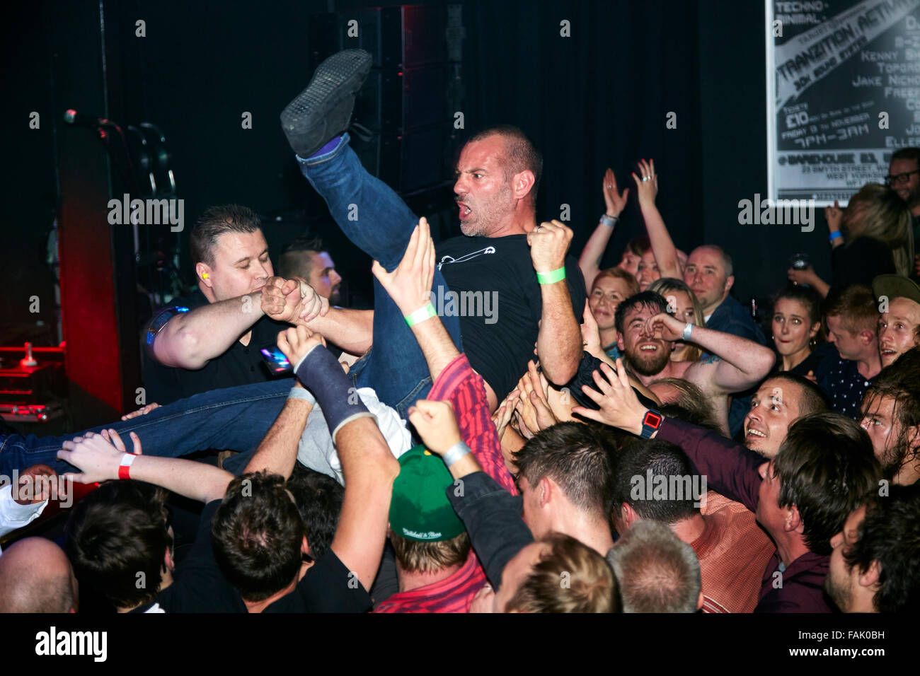 Jim McManus, lead vocailist with Milloy crowd-surfing during concert in Wakefield. Stock Photo