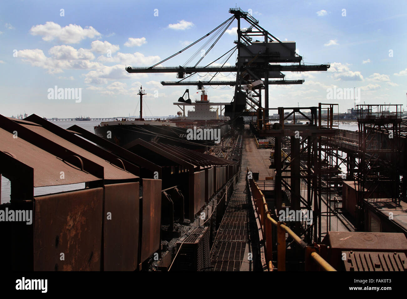 Dockside unloading machines for bulk transport vessels. Stock Photo