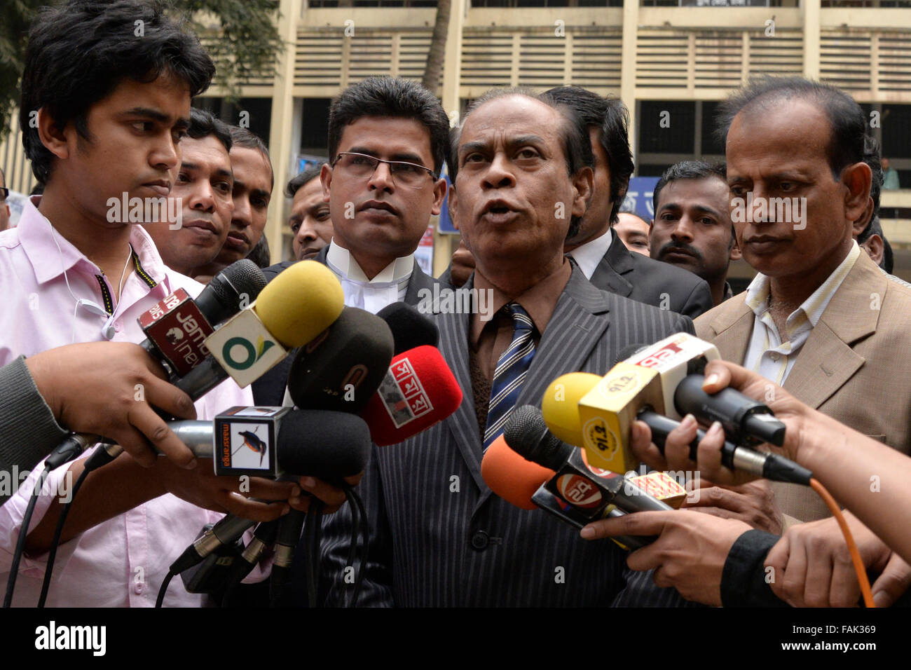 Dhaka, Bangladesh. 31st Dec, 2015. Bangladesh blogger Ahmed Rajib Haider's father Nizam Uddin (2R) speaks with journalist after Dhaka Special Trial Tribunal-3 Judgment in Dhaka on December 31, 2015  A Dhaka court handed death penalty to two, life term jail to another, five-year imprisonment for militant outfit Ansarullah Bangla Team chief Mufti Jashimuddin Rahmani and various jail terms for five others for killing blogger Rajib in February 2013 – the first in series of blogger killings in Bangladesh. Credit:  Mamunur Rashid/Alamy Live News Stock Photo