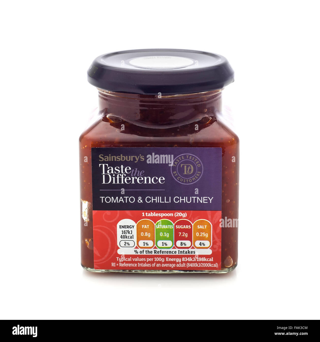 Jar of Sainsbuys Taste the Difference Tomato and Chilli Chutney on a White Background Stock Photo