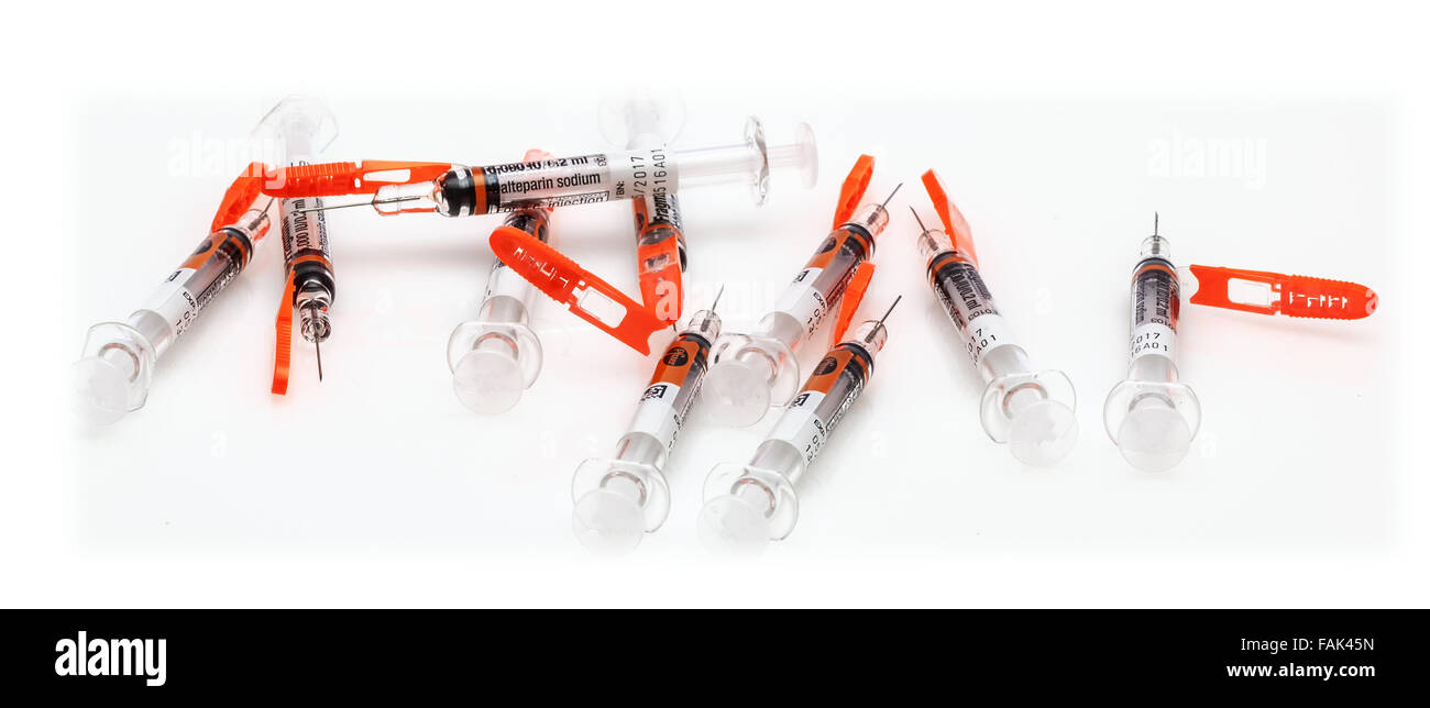 Collection of Single Dose Syringes from Pfizer on a White Background Stock Photo