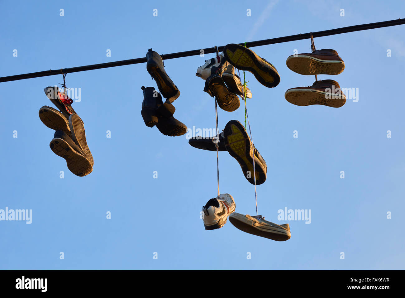 Shoes Hanging from Wire Stock Photo
