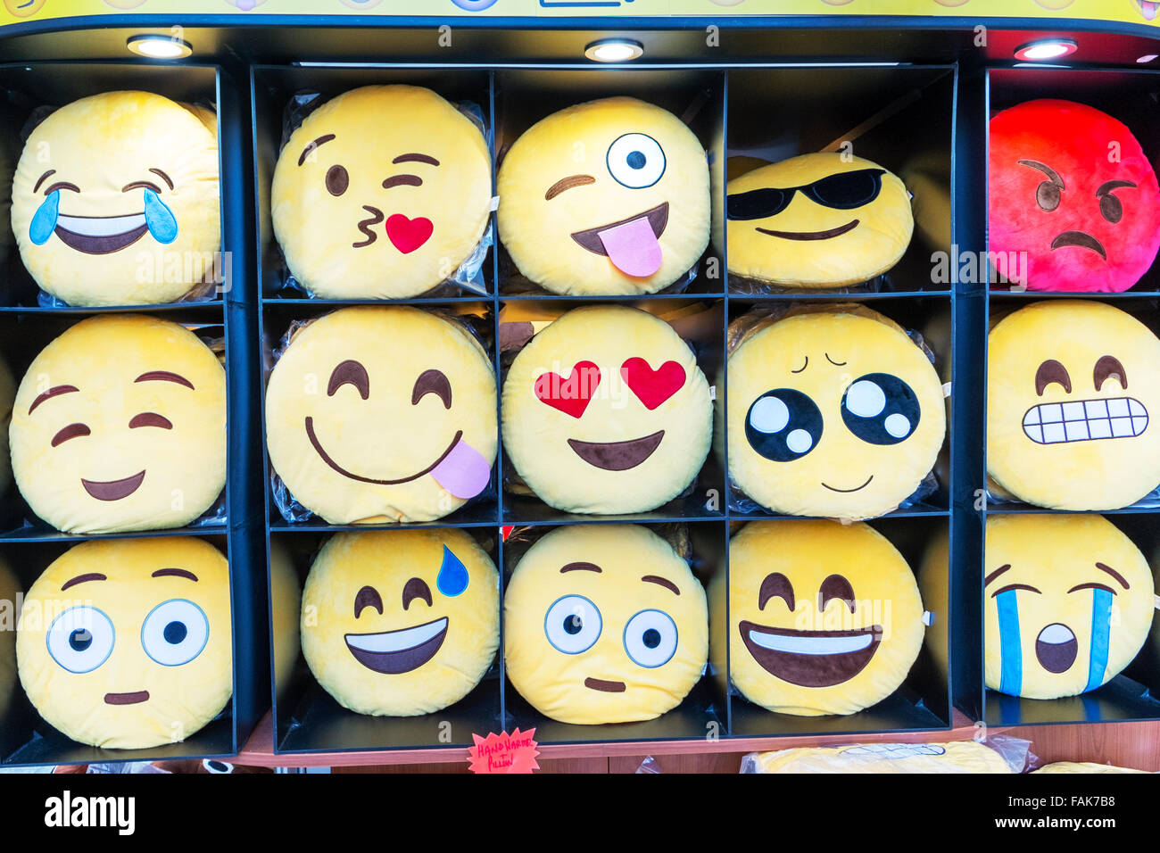 Emoji Emojis emoticon teen language smilies happy sad cheeky angry face faces phone gestures text texting shorthand emoticons Stock Photo