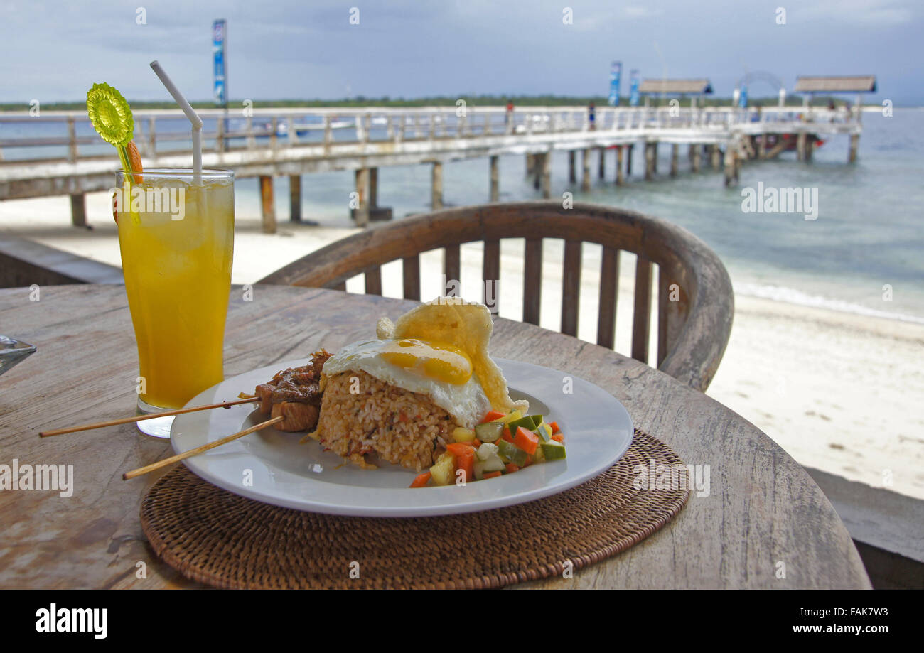 Local lunch whilst waiting for the boat to arrive from Bali at the jetty on Gili Islands, Indonesia Stock Photo