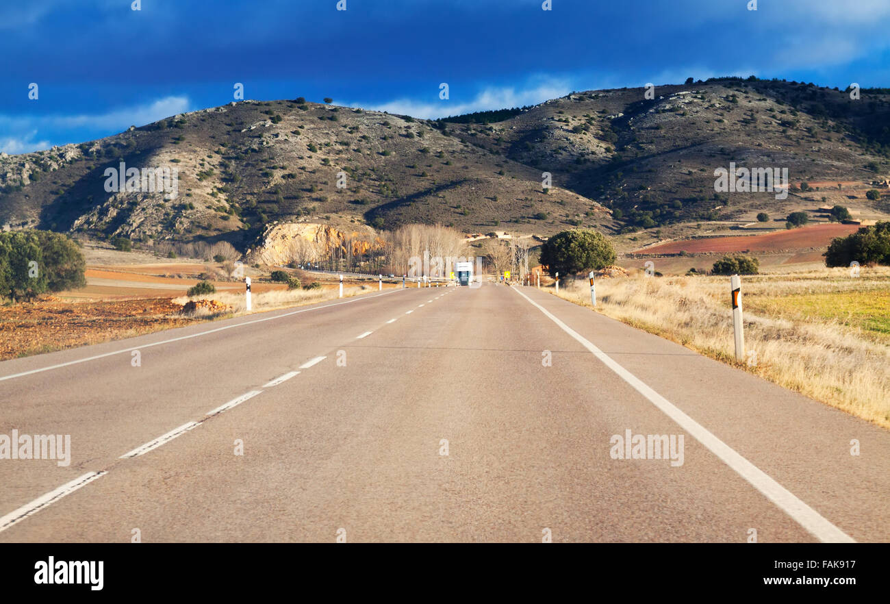 Asphalt road among fields and hills Stock Photo - Alamy