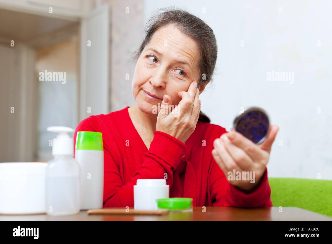 Mature woman mirror sad hi-res stock photography and images - Alamy