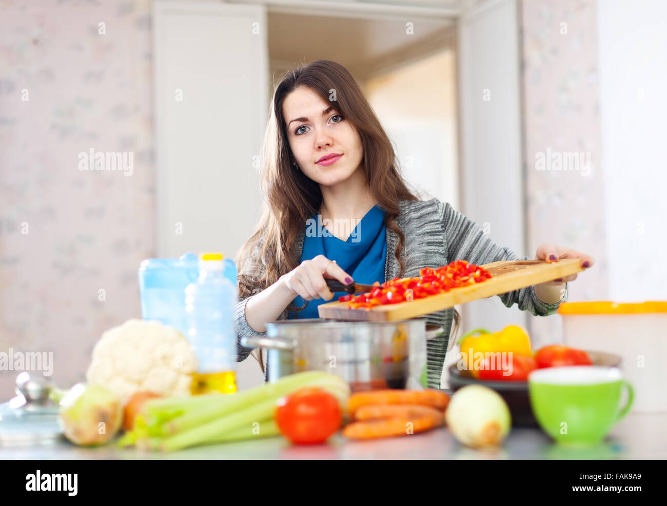 Beautiful woman cooking veggie hi-res stock photography and images - Alamy