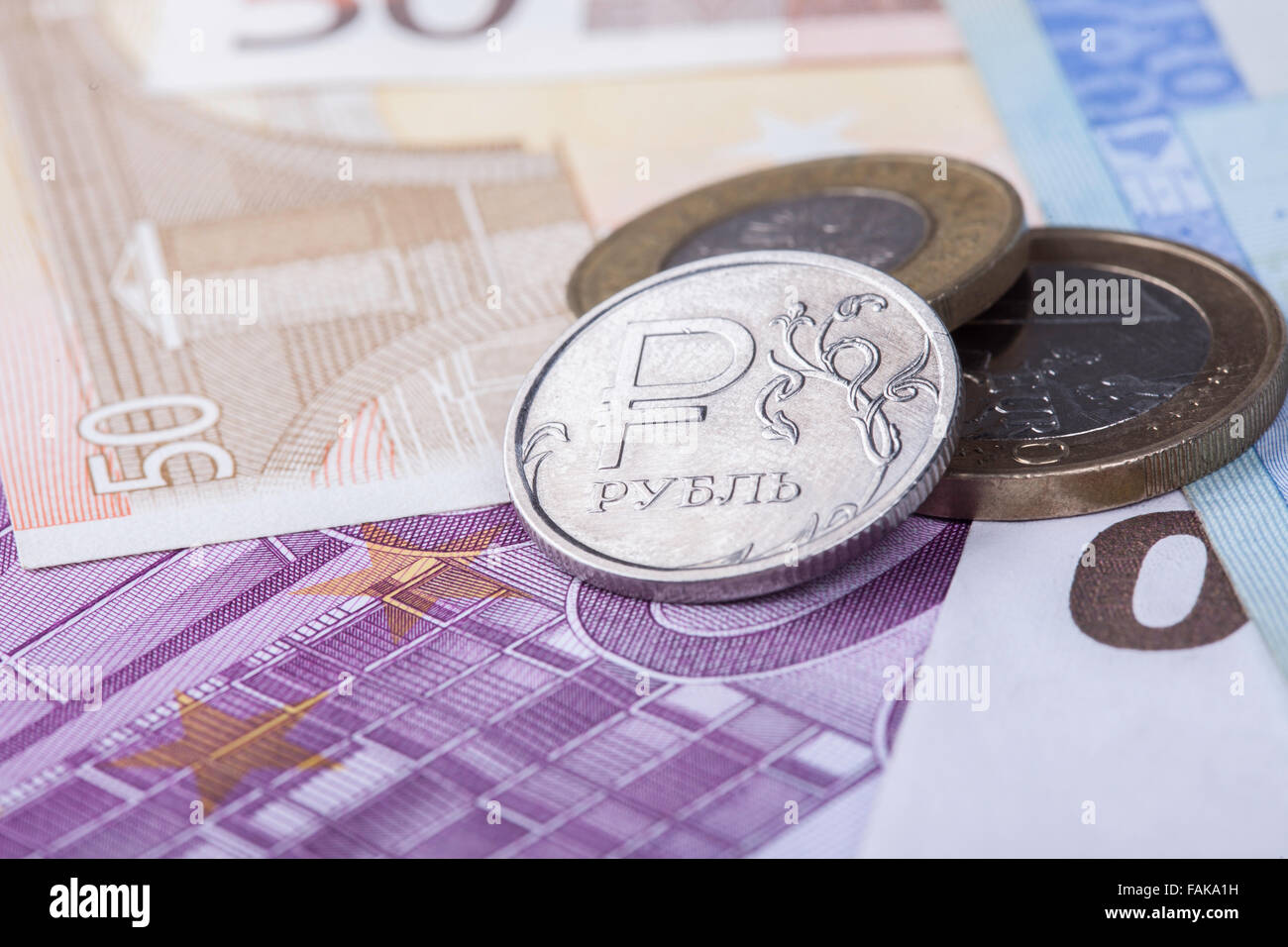 coin ruble against the background of Euro banknotes Stock Photo