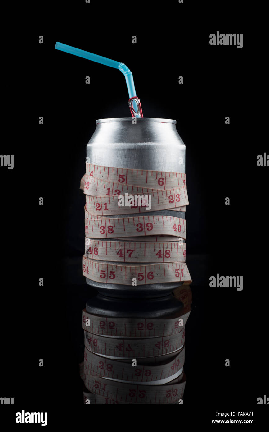 can of cola drink with tape measure, concept. Stock Photo