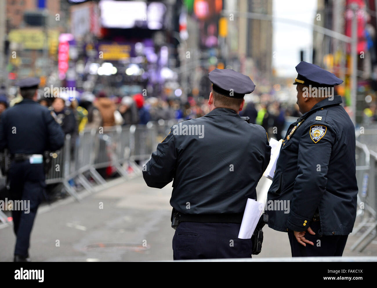 New York, USA. 31st Dec, 2015. Police officers stand guard at Times ...