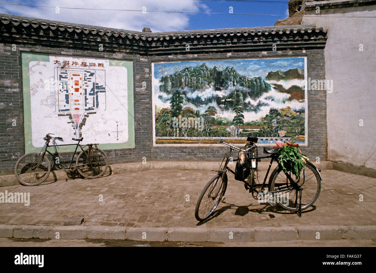 bicycles and vegetables against mountain view picture, Hohhot, capital of Inner Mongolia, Autonomous Region, Northern China Stock Photo