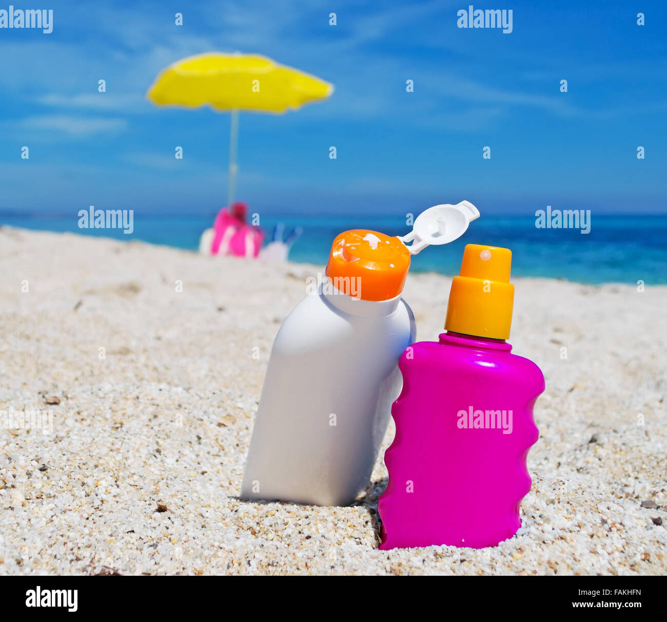 two suntan lotion bottles on the sand Stock Photo - Alamy