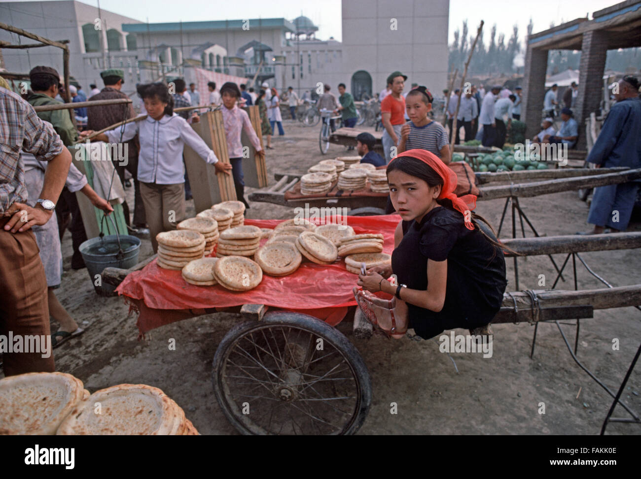 Selling Nan flat bread in Turpan market, Xinjiang Prvince, China Stock Photo
