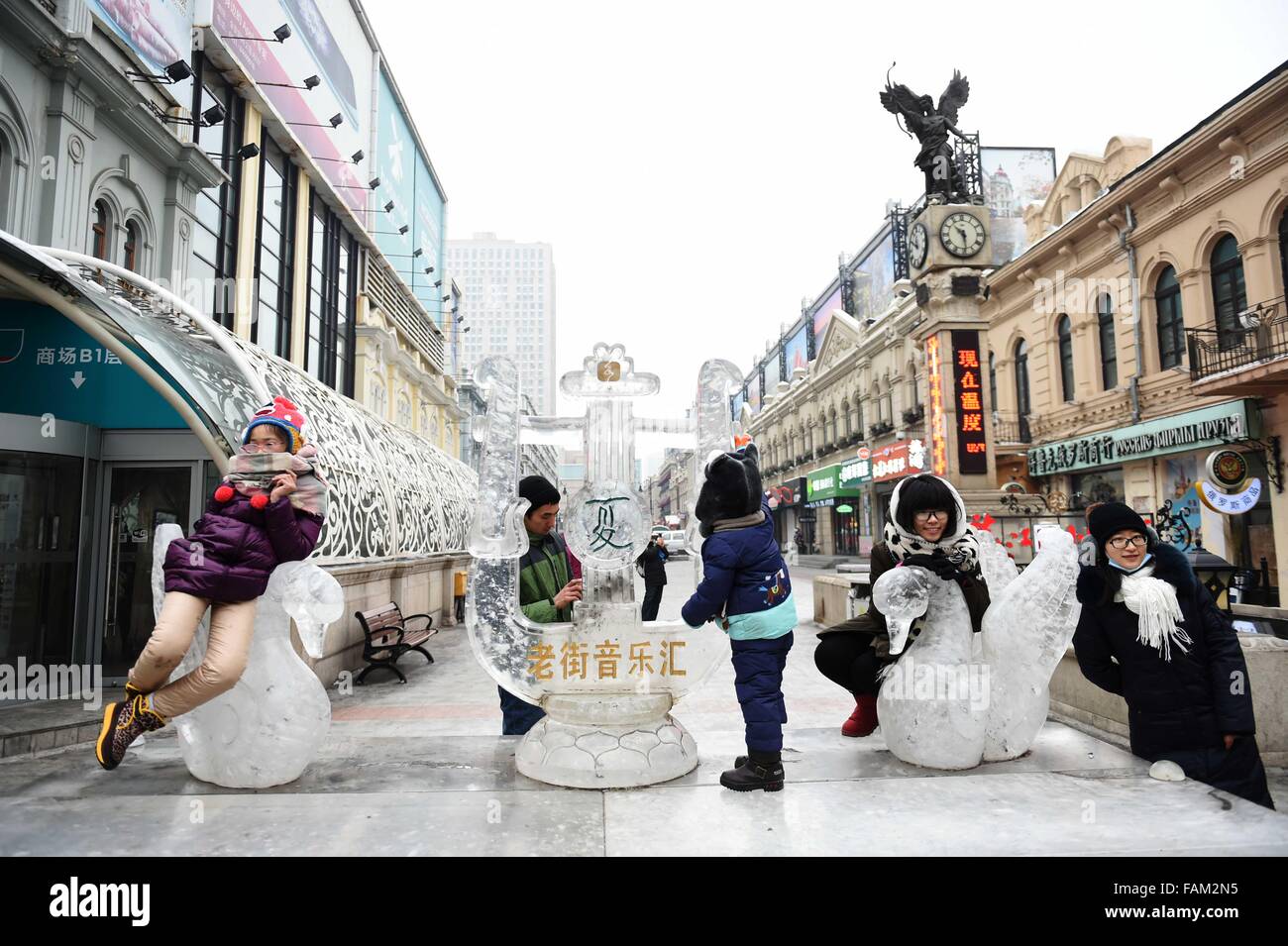 Harbin, China's Heilongjiang Province. 1st Jan, 2016. Tourists have a good time with ice sculptures to celebrate the New Year's Day in Harbin, capital of northeast China's Heilongjiang Province, on Jan. 1, 2016. Credit:  Wang Jianwei/Xinhua/Alamy Live News Stock Photo