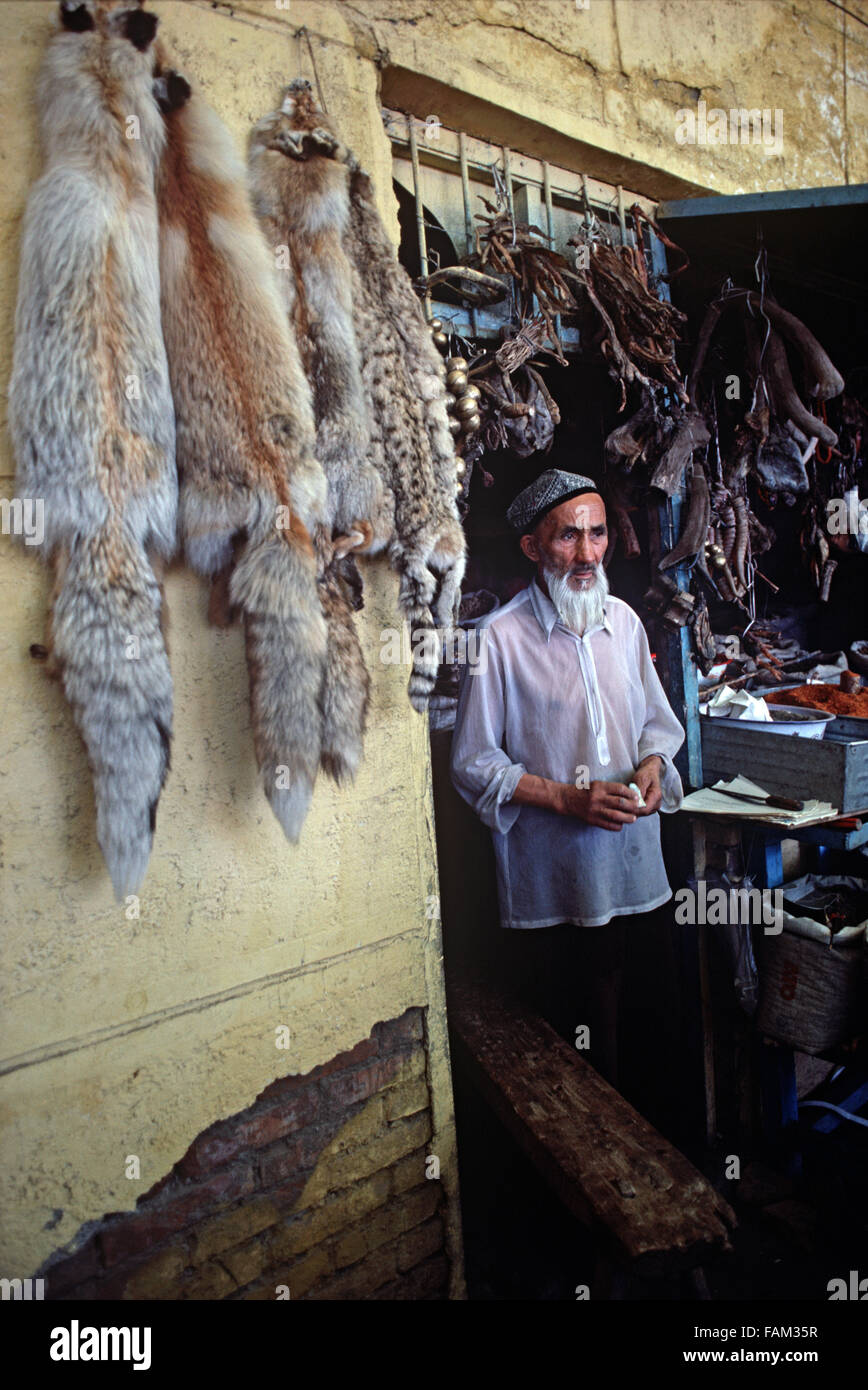 Trader in Illegal furs and animal bones used in Chinese medicine, Urumqi  market, Xinjiang Province, China Stock Photo - Alamy