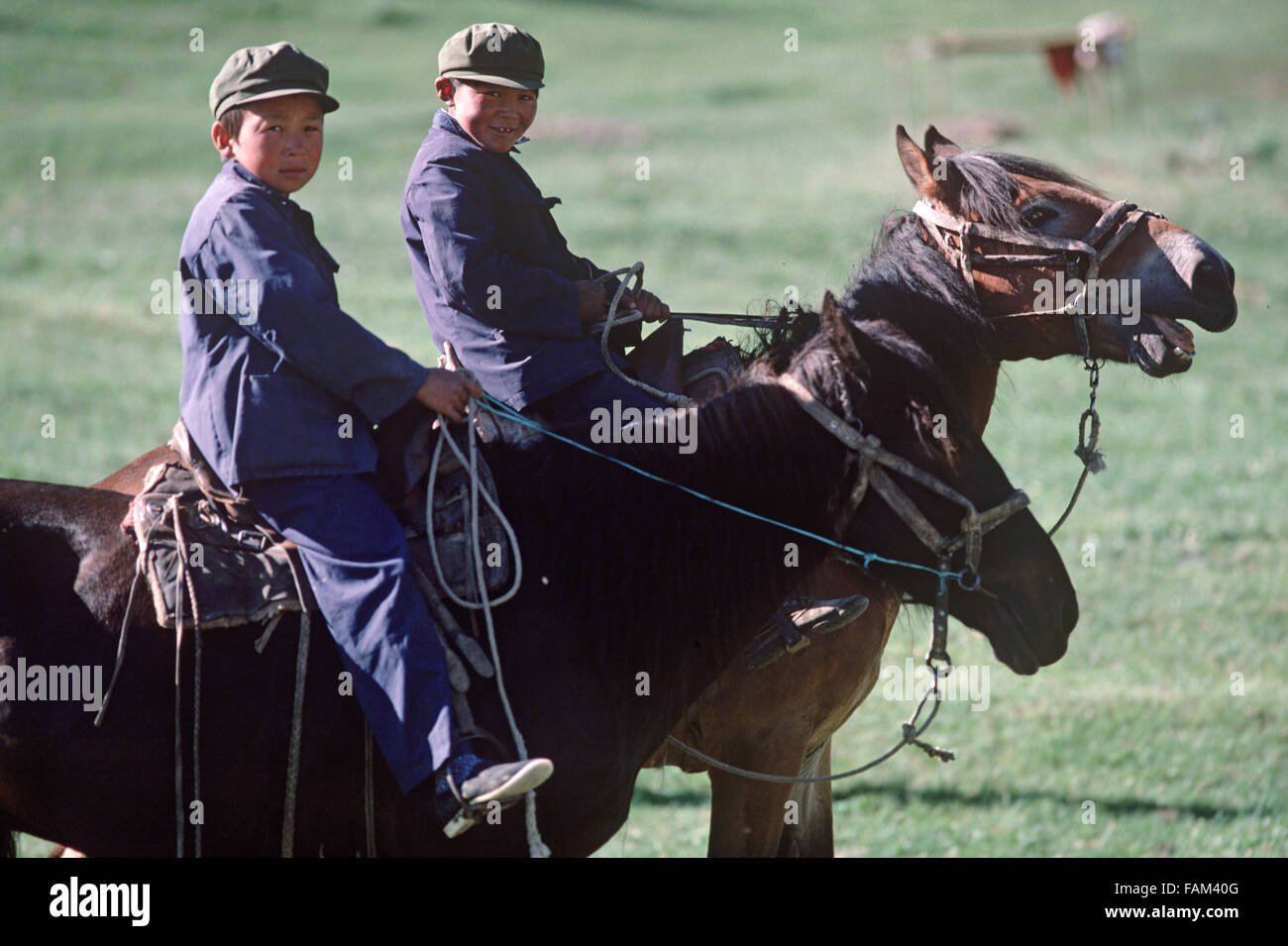 young Kazakh horsemen in hills North of Urumqi, Xianjiang Province, Autonomous Region, China Stock Photo