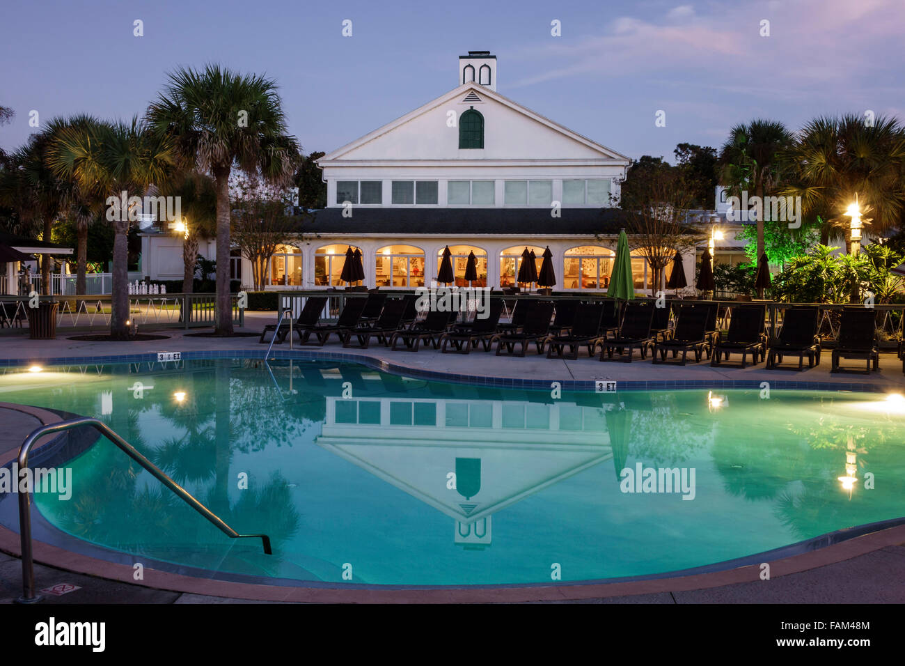 Florida Crystal River water,Plantation on Crystal River water Resort,hotel hotels lodging inn motel motels,evening,night,swimming pool area,visitors t Stock Photo