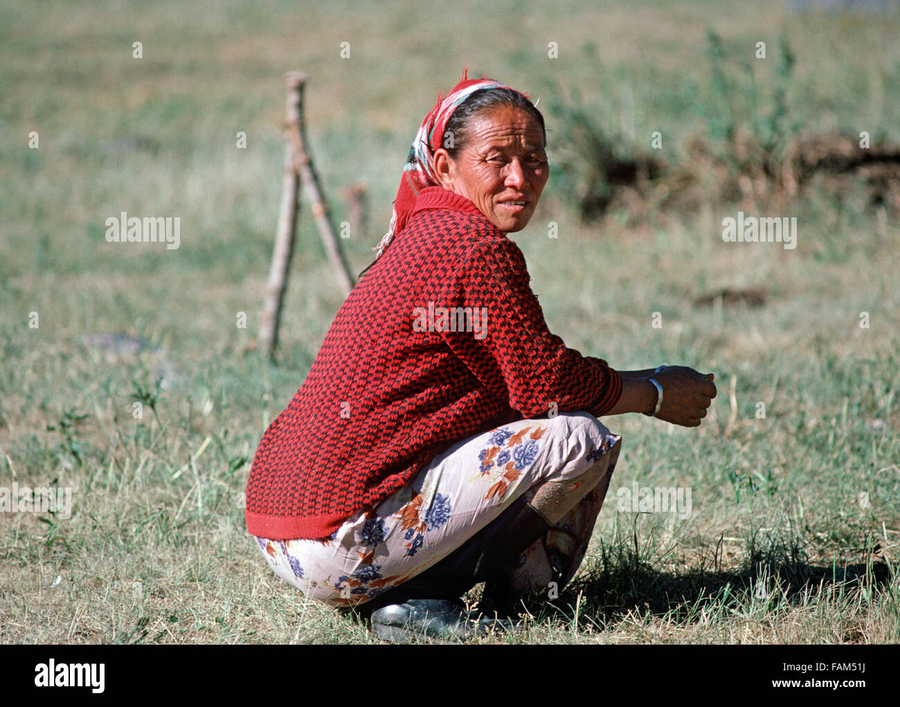 Kazakh woman in hills North of Urumqi, Xinjiang Province, China Stock Photo