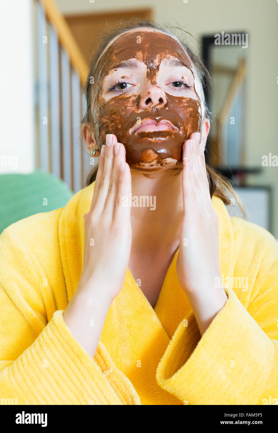 Beauty woman applying a facial mask at home Stock Photo - Alamy