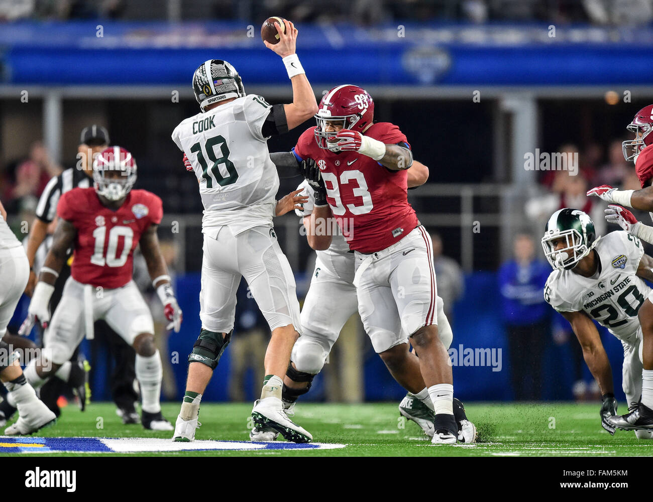Arlington, Texas. 31st Dec, 2015. Michigan State Spartans quarterback Connor Cook (18) looks down field as Alabama Crimson Tide defensive lineman Jonathan Allen (93) rushes and gets a sack during the 2015 Goodyear Cotton Bowl game between the Michigan State Spartans and Alabama Crimson Tide at the AT&T Stadium in Arlington Texas.Alabama wins 38-0. Credit:  Manny Flores/Cal Sport Media/Alamy Live News Stock Photo
