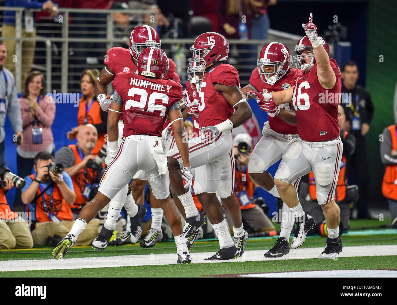 Arlington, Texas. 31st Dec, 2015. Alabama Crimson Tide defensive back Cyrus Jones (5) has a 57-yard punt return for a touchdown as teammates Alabama Crimson Tide defensive back Anthony Averett (28) and Alabama Crimson Tide tight end Michael Nysewander (46) celebrate during the 2015 Goodyear Cotton Bowl game between the Michigan State Spartans and Alabama Crimson Tide at the AT&T Stadium in Arlington Texas.Alabama wins 38-0. Credit:  Manny Flores/Cal Sport Media/Alamy Live News Stock Photo