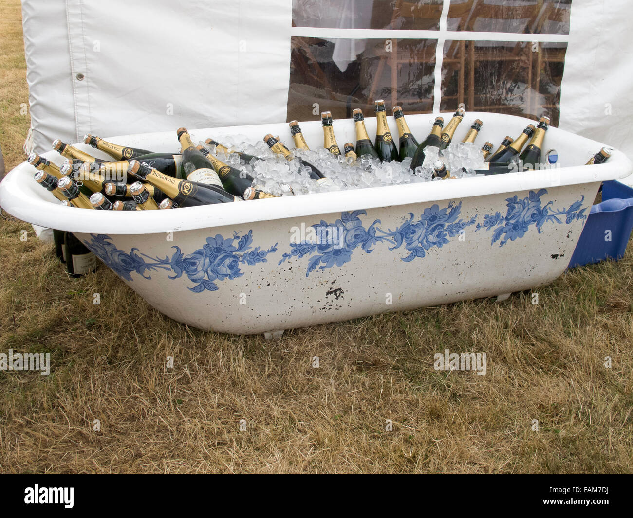 A decorated antique bath filled with champagne and ice for a wedding. Stock Photo