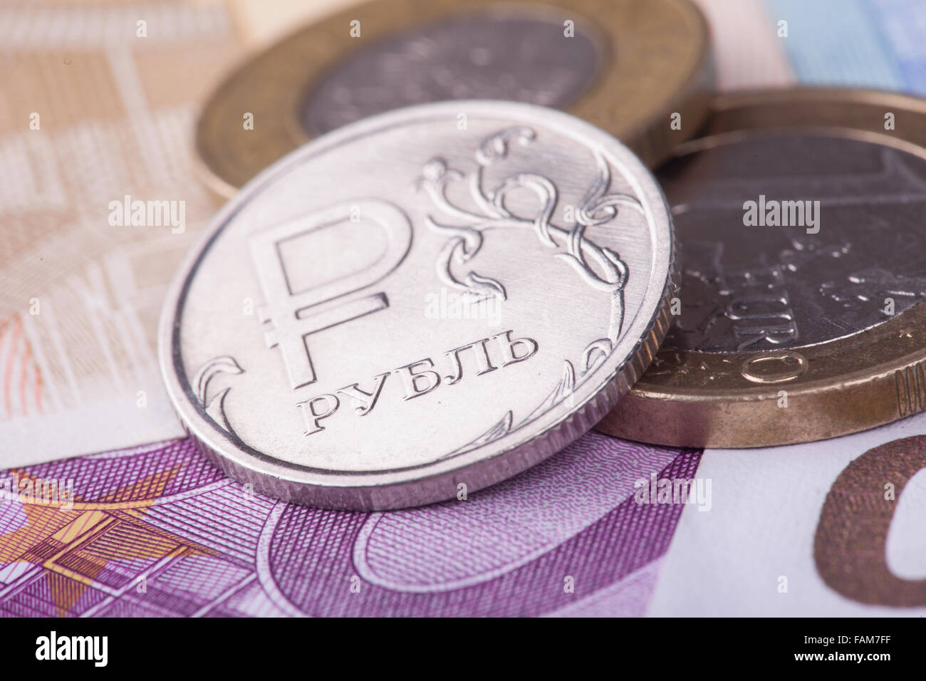 coin ruble against the background of Euro banknotes Stock Photo