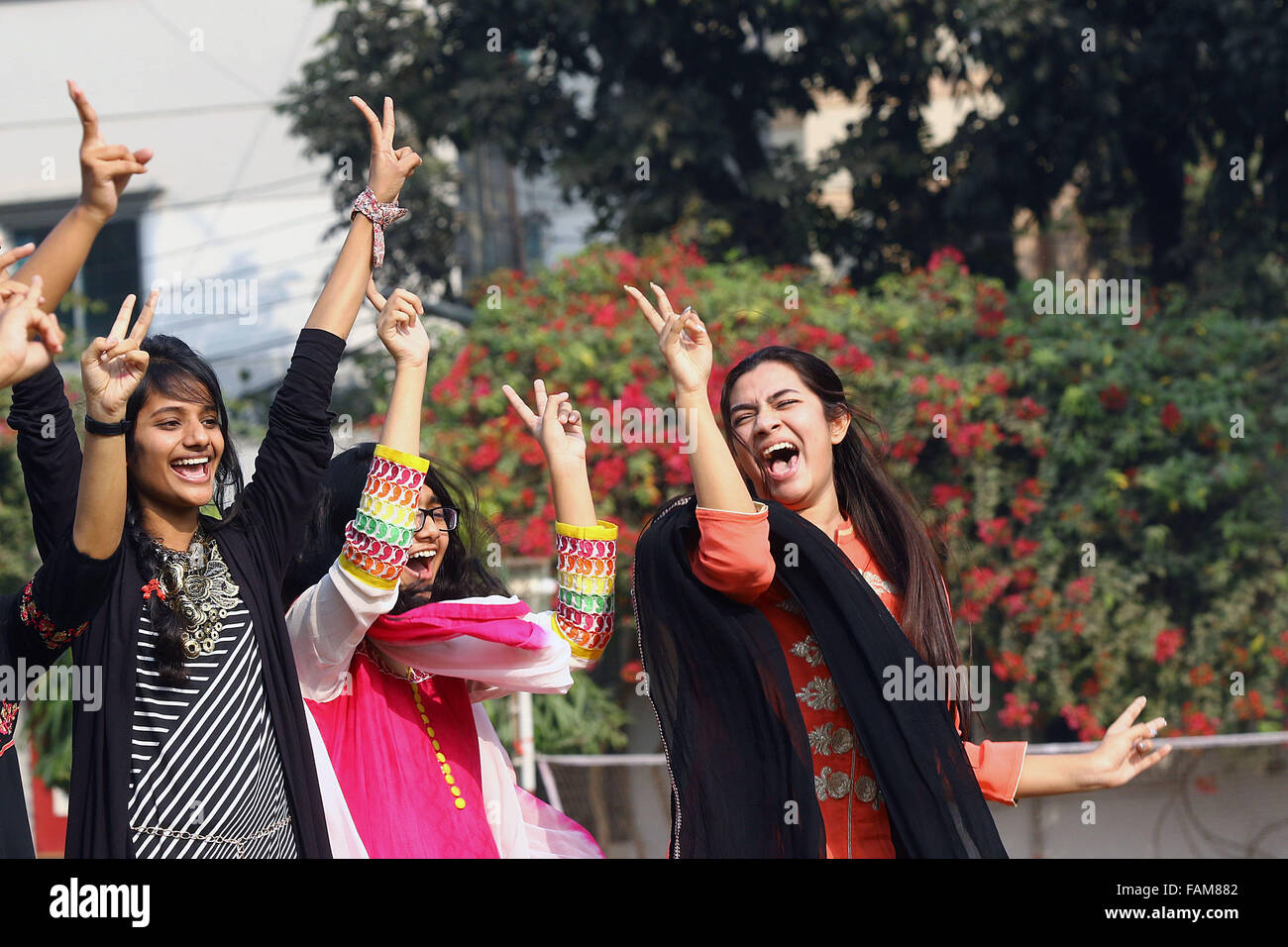 Dhaka, Bangladesh. 31 December 2015.Rajuk Uttara Model College student jumps for joy at seeing results of Junior School Certificate exams. Stock Photo