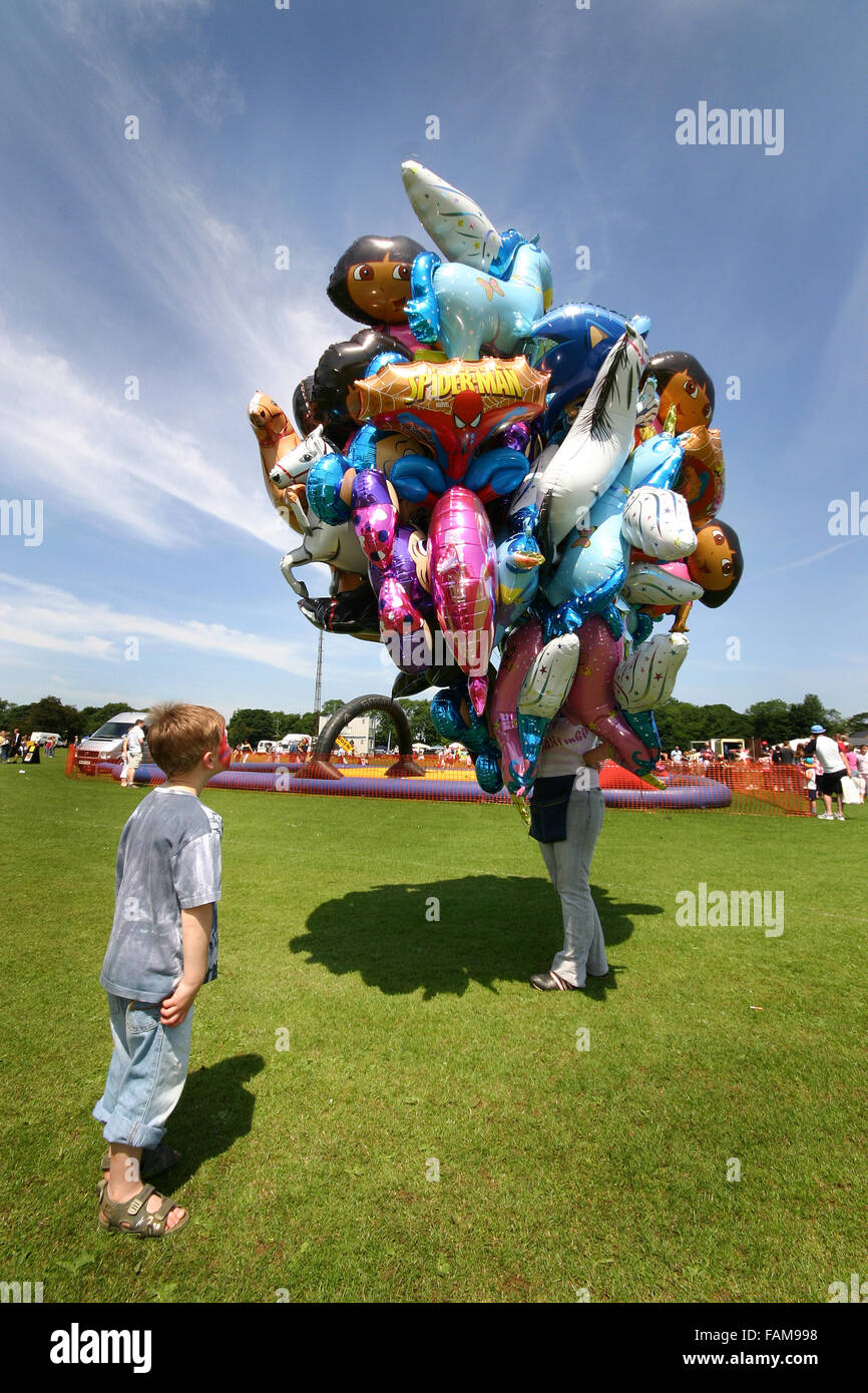 Child looking at balloons for sale. Stock Photo