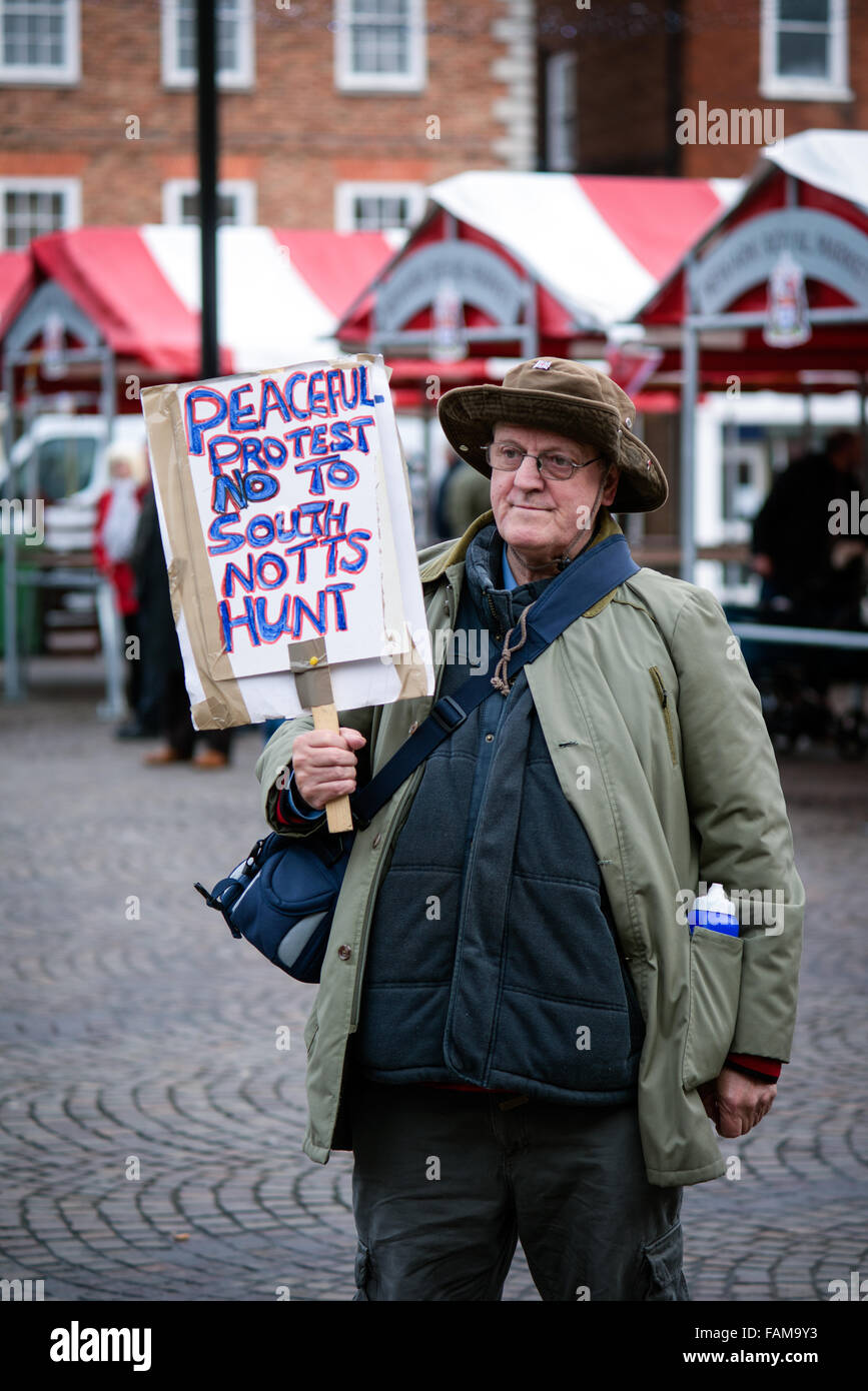 Newark-On-Trent, UK. 01st January, 2015. Large crowds turned out on new years day morning for the annual South Notts hunt meeting. They gathered in Newarks market square before setting off in to the Nottinghamshire countryside. One lone protester with placard attended 'Laurence Goff'  he staged a peaceful protest . Credit:  Ian Francis/Alamy Live News Stock Photo