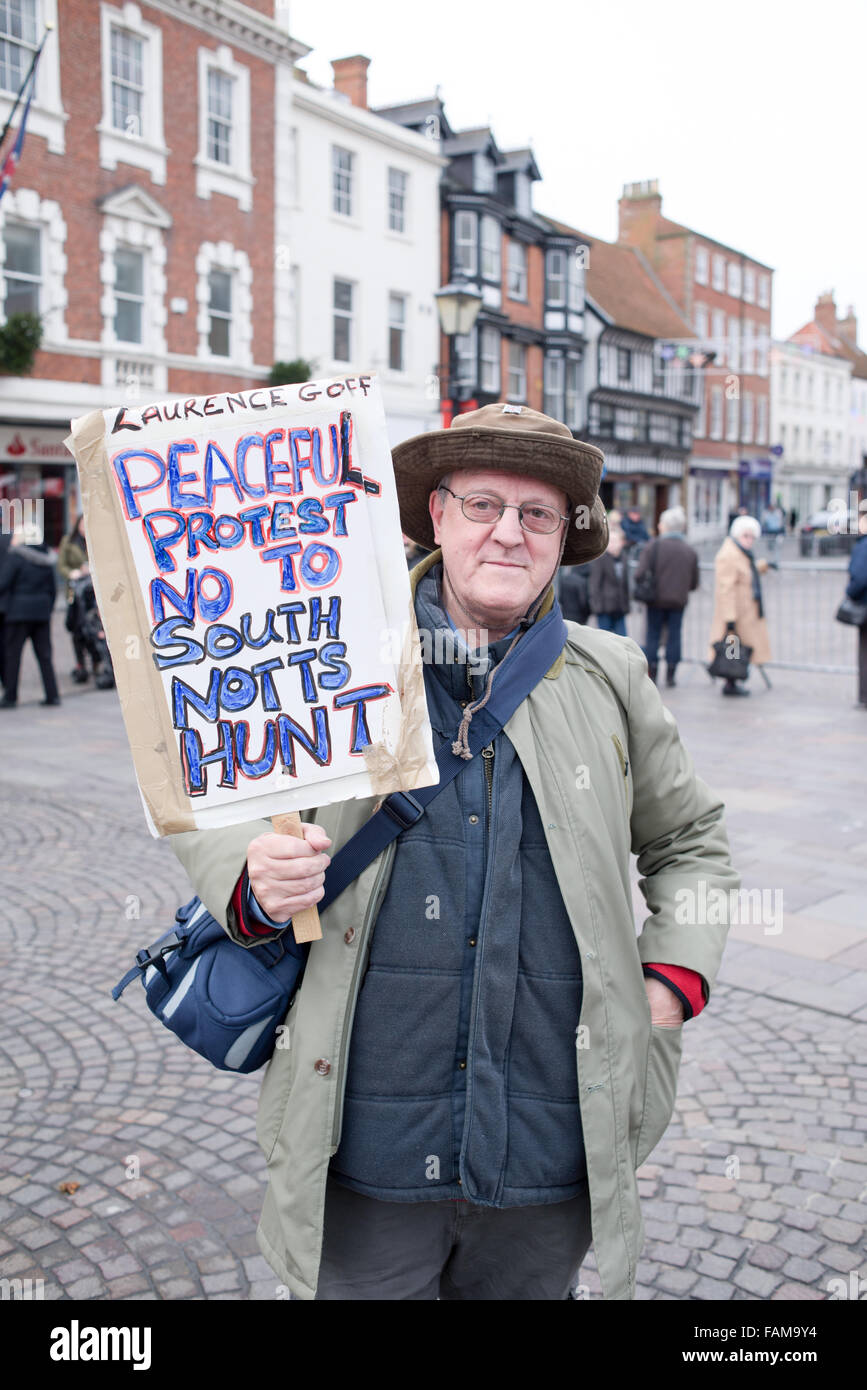 Newark-On-Trent, UK. 01st January, 2015. Large crowds turned out on new years day morning for the annual South Notts hunt meeting. They gathered in Newarks market square before setting off in to the Nottinghamshire countryside. One lone protester with placard attended 'Laurence Goff'  he staged a peaceful protest . Credit:  Ian Francis/Alamy Live News Stock Photo
